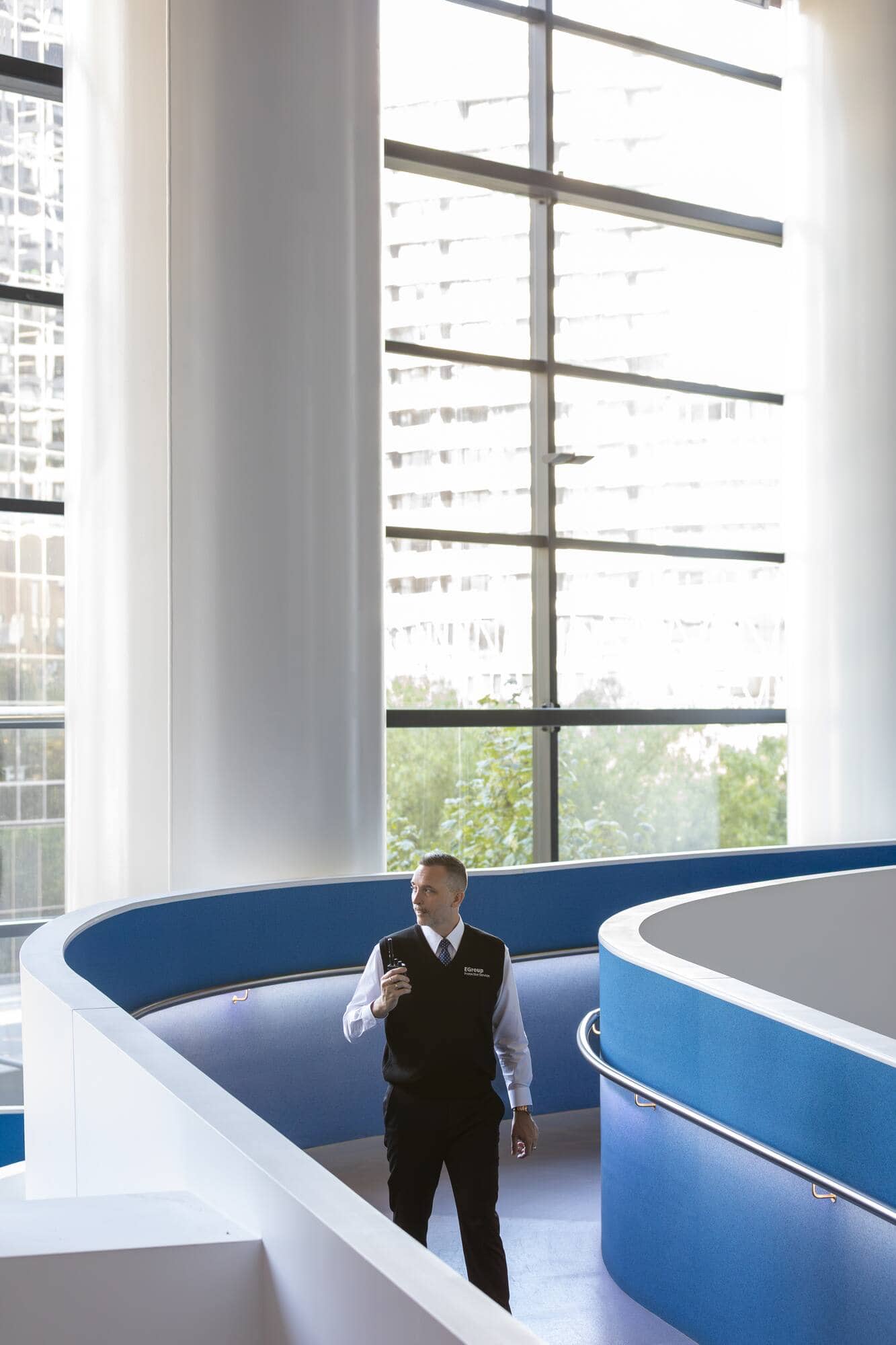 Security consultants reviewing plans at a front desk