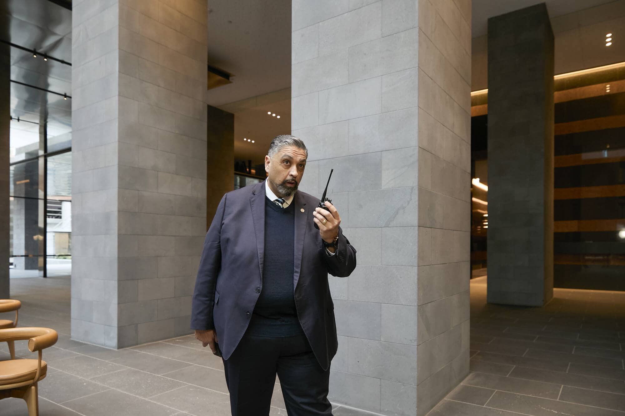 Corporate security officer using radio communications equipment